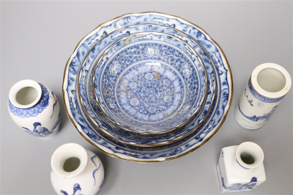 A graduated set of three Chinese porcelain blue and white bowls, largest 19cm and a group of four miniature Chinese blue and white vase